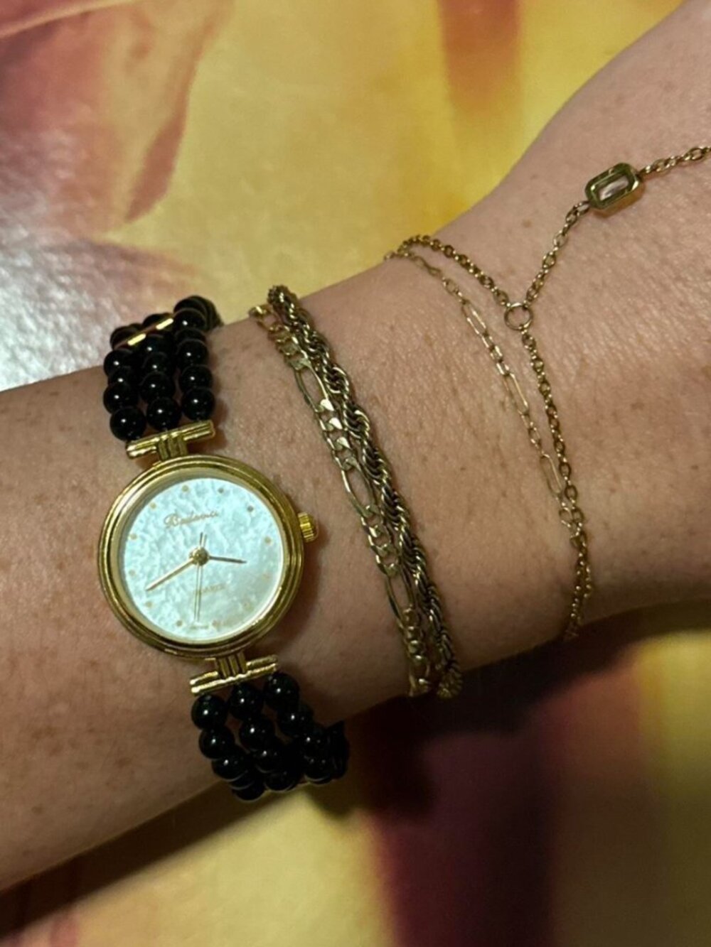 Women's Gold and Black Watch